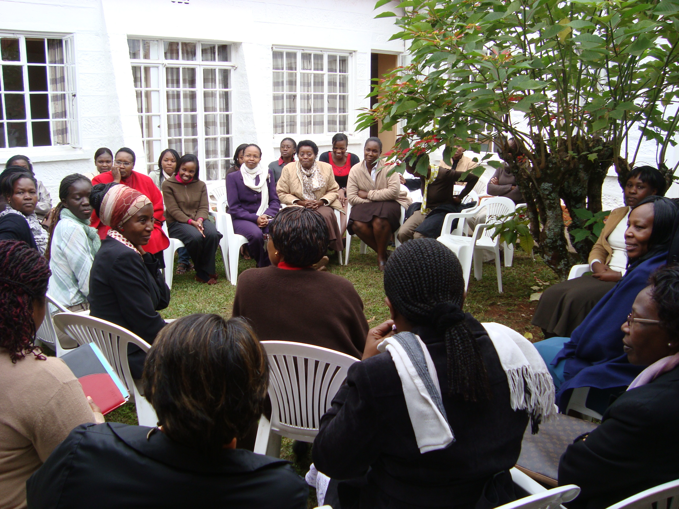 Participants seated in a circle during a humanitarian leadership programme